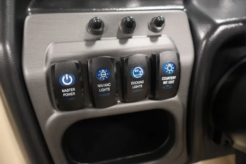 Slide: The Image of Control panel of 2027 Bentley Pontoons 200 CRUISE XL with labeled switches. - 12