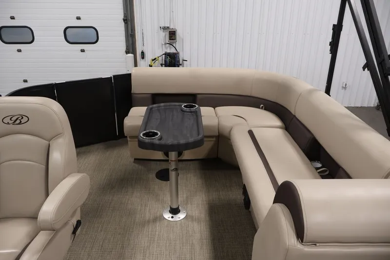 Slide: The Image of 2027 Bentley Pontoons 200 CRUISE XL interior with beige seating and central table. - 21