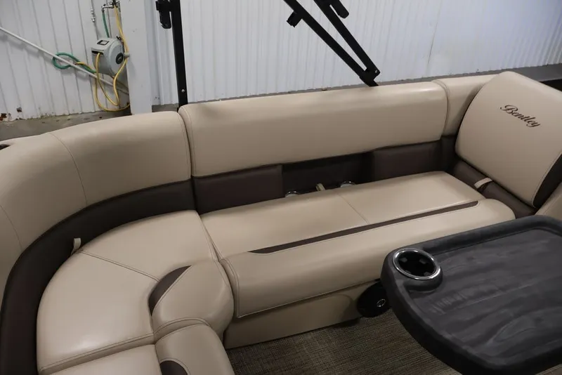 Slide: The Image of Luxurious seating in 2027 Bentley Pontoons 200 CRUISE XL with beige upholstery and cup holder. - 25