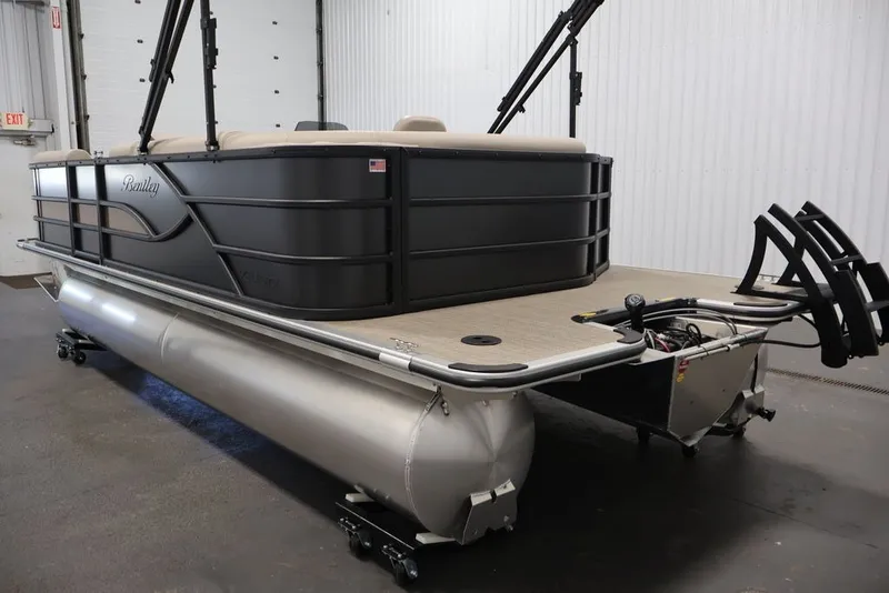 Slide: The Image of 2027 Bentley Pontoons 200 CRUISE XL in a showroom, showcasing sleek design and modern features. - 30
