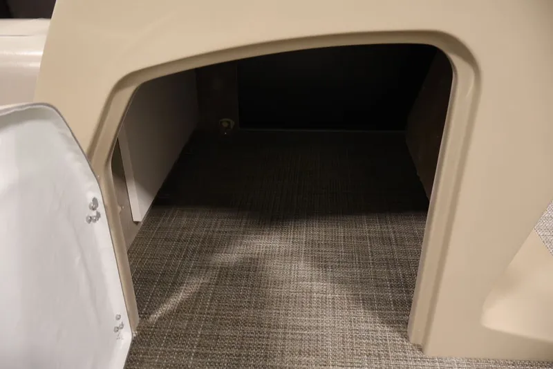 Slide: The Image of Storage compartment in 2027 Bentley Pontoons 200 CRUISE XL with carpeted interior. - 11