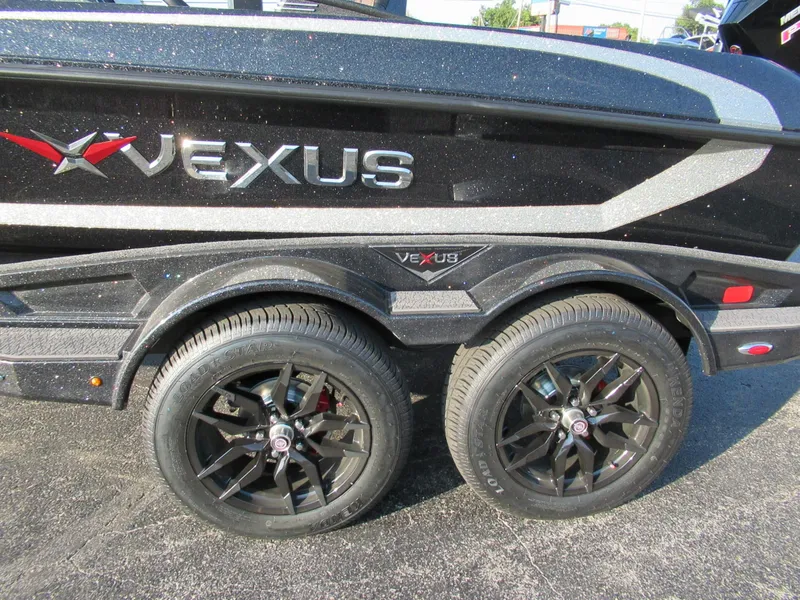 Slide: The Image of Close-up of a Vexus VXs21 boat trailer with stylish black wheels and a sleek black finish. - 4