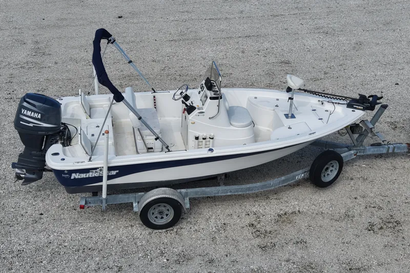 Slide: The Image of 2009 NauticStar 1810 NauticBay boat on trailer with Yamaha outboard motor. - 5