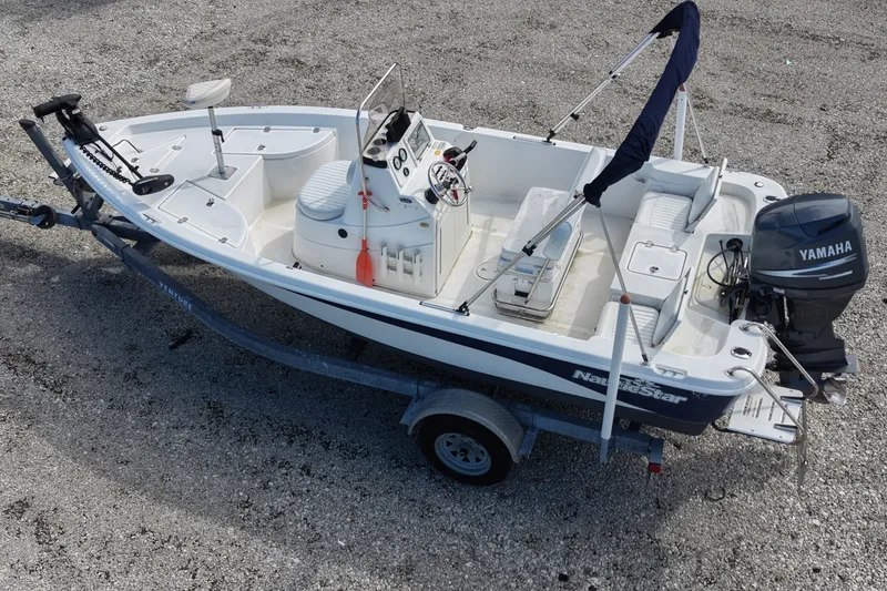 Slide: The Image of 2009 NauticStar 1810 NauticBay boat on trailer with Yamaha outboard motor. - 3