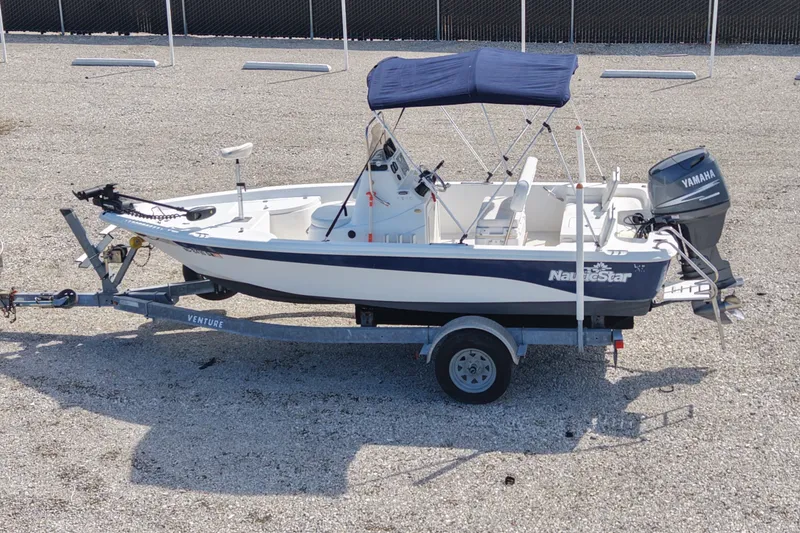 Slide: The Image of 2009 NauticStar 1810 NauticBay boat on trailer with Yamaha outboard motor. - 10