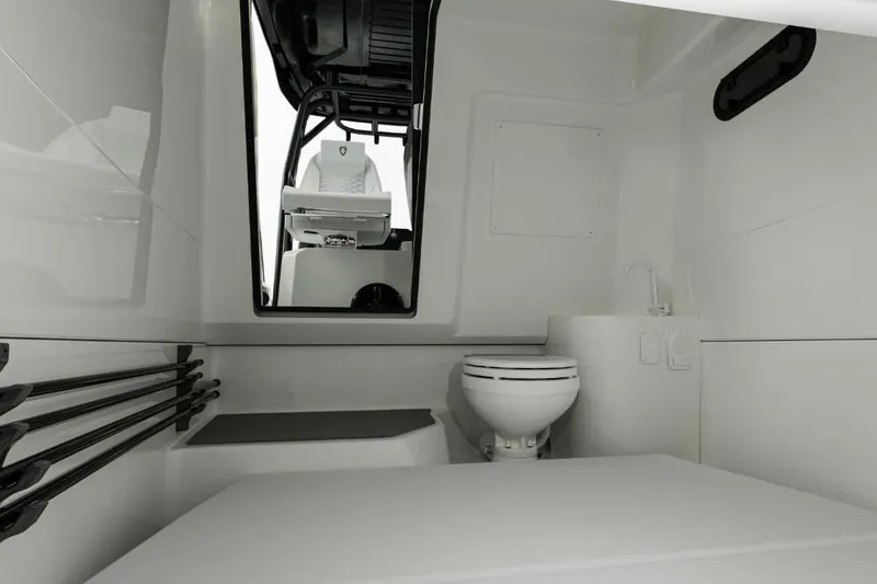 Slide: The Image of Manufacturer Provided Image: Interior of 2026 Navan T30 boat featuring a compact bathroom with toilet and sink. - 8