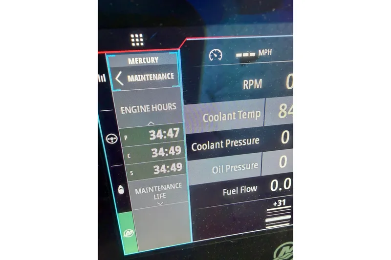 Slide: The Image of Dashboard display of 2024 Wellcraft 38 Explorer showing engine hours and maintenance data. - 4