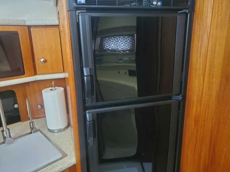 Slide: The Image of Interior of 2000 Carver 356 Aft Cabin Motor Yacht with fridge and sink. - 33