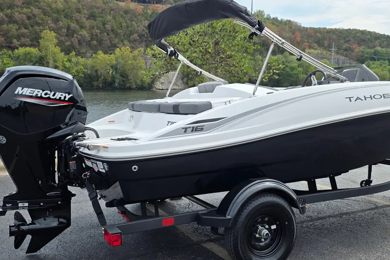 Slide: The Image of 2027 Tahoe T16 boat with Mercury engine on trailer by a scenic river. - 6