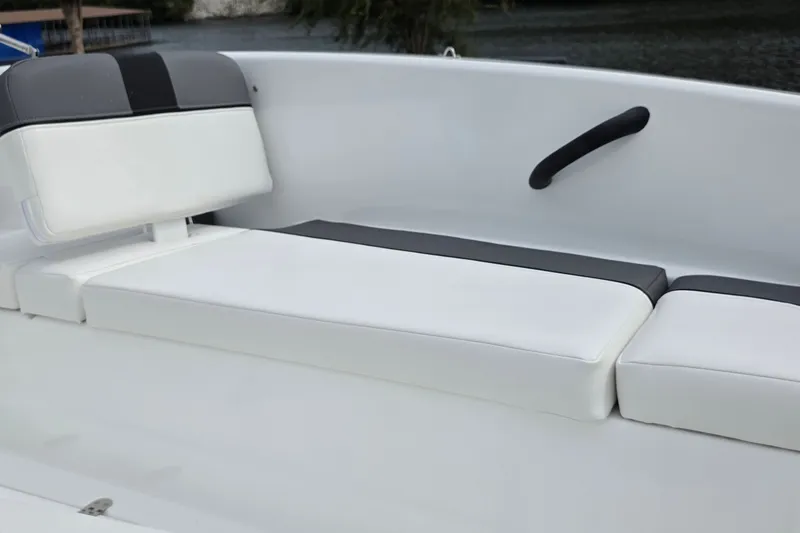Slide: The Image of White and gray seating on 2027 Tahoe T16 boat, featuring sleek design and comfortable cushions. - 8