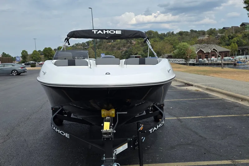 Slide: The Image of 2027 Tahoe T16 boat on trailer in parking lot, scenic background. - 4