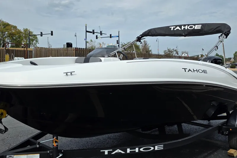 Slide: The Image of 2027 Tahoe T16 boat on trailer, sleek design, black and white color scheme. - 3