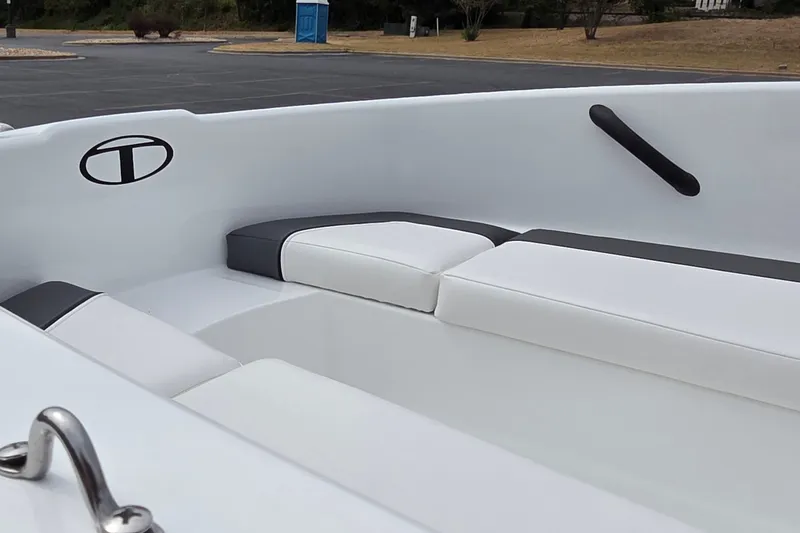 Slide: The Image of 2027 Tahoe T16 boat interior with white cushioned seating and sleek design. - 7