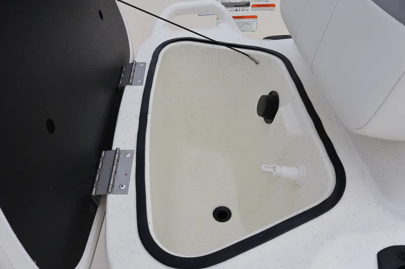 Slide: The Image of Open storage compartment in 2026 Mako Pro Skiff 13 CC boat interior. - 18