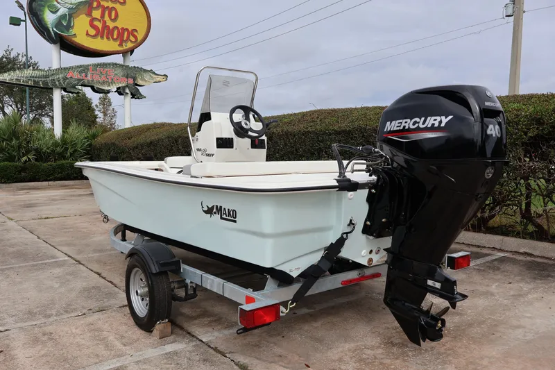 Slide: The Image of 2026 Mako Pro Skiff 13 CC boat with Mercury 40 engine on trailer. - 3