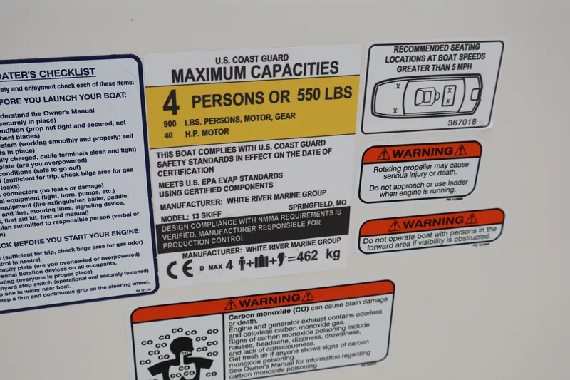Slide: The Image of Capacity label on 2026 Mako Pro Skiff 13 CC, detailing safety and weight limits. - 20