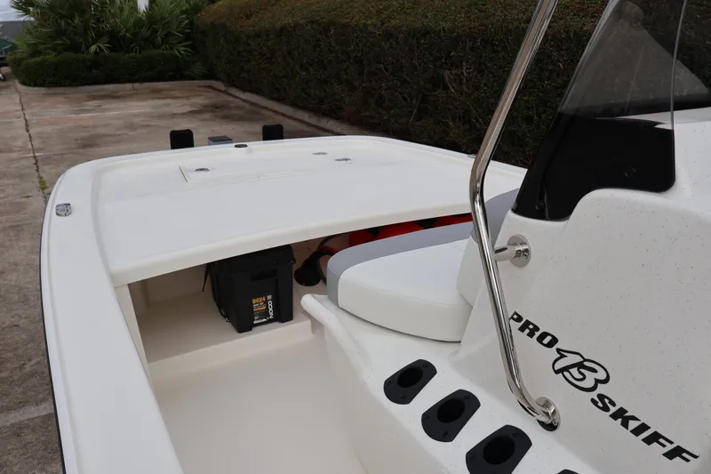 Slide: The Image of 2026 Mako Pro Skiff 13 CC boat interior with storage compartment and seating. - 10
