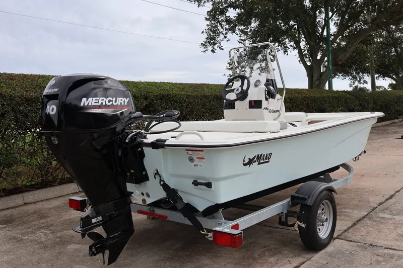 The Image of 2026 Mako Pro Skiff 13 CC with Mercury engine on a trailer. - 0
