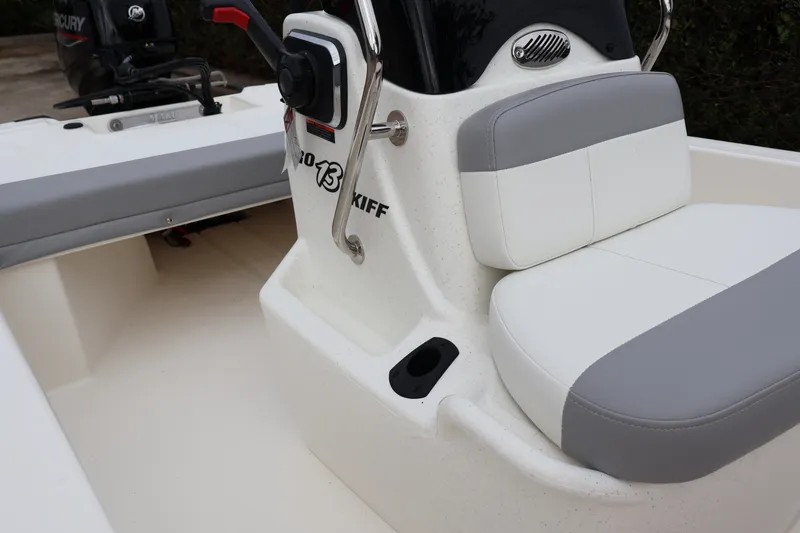 Slide: The Image of 2026 Mako Pro Skiff 13 CC boat interior with seating and control console. - 7