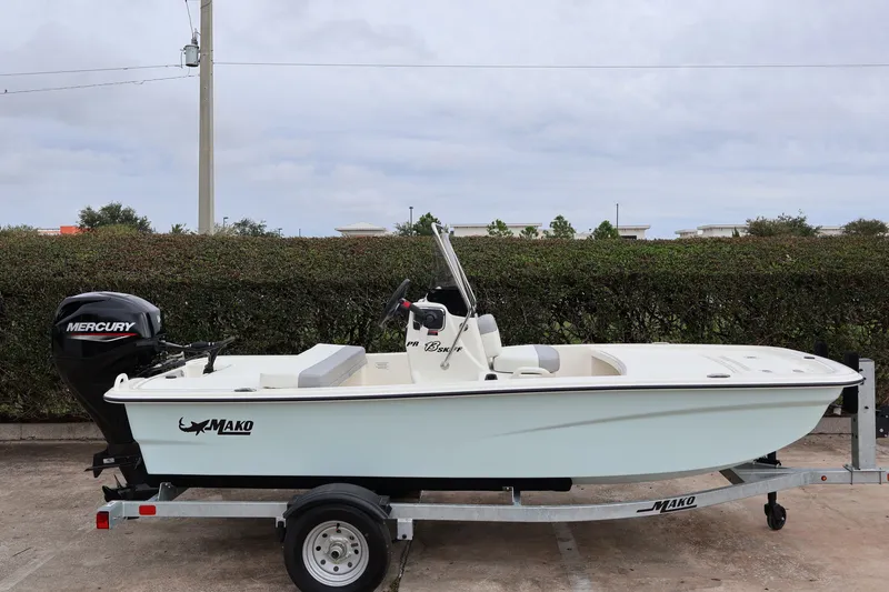 Slide: The Image of 2026 Mako Pro Skiff 13 CC boat on trailer with Mercury outboard motor. - 4