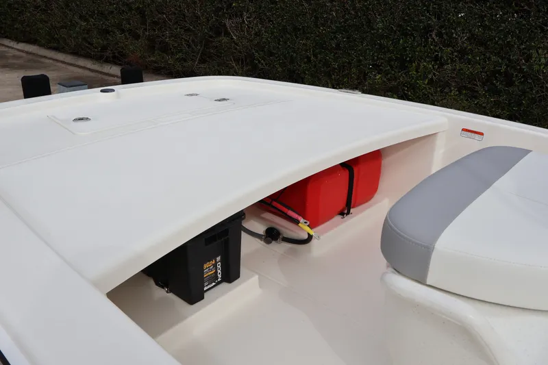 Slide: The Image of 2026 Mako Pro Skiff 13 CC boat interior with storage compartment and seating. - 16