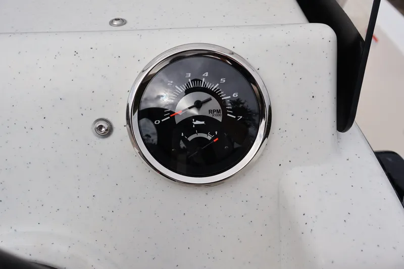 Slide: The Image of Tachometer on 2026 Mako Pro Skiff 13 CC boat dashboard, showing RPM gauge. - 12