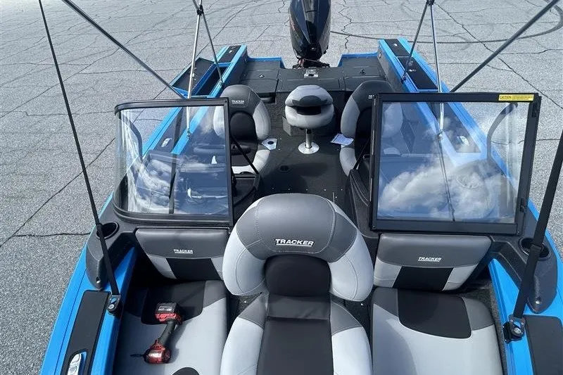 Slide: The Image of 2027 Tracker Targa V-18 Combo boat interior with seating and windshield, showcasing modern design. - 13