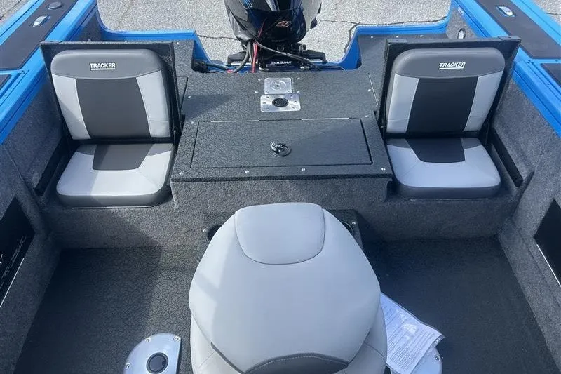 Slide: The Image of 2027 Tracker Targa V-18 Combo boat interior with seating and storage compartments. - 14