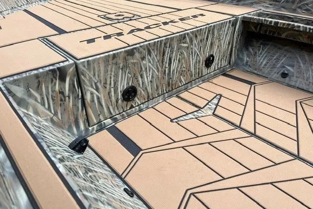 Slide: The Image of 2027 Tracker Grizzly 1553 Timber boat deck with camo design and logo detailing. - 25