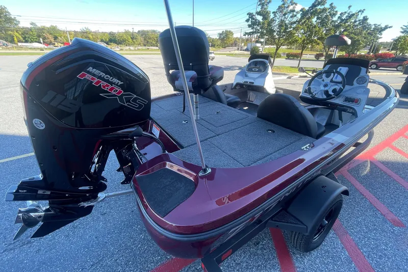 Slide: The Image of 2027 Nitro Z17 boat with Mercury Pro XS engine, parked outdoors. - 2