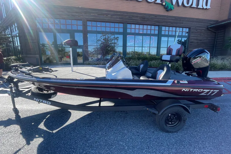 Slide: The Image of 2027 Nitro Z17 boat parked outside a store, showcasing sleek design and modern features. - 1