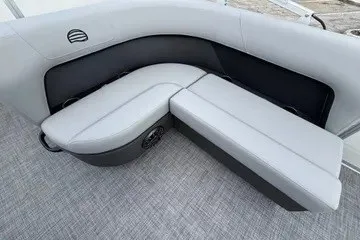 Slide: The Image of 2027 Sun Tracker Party Barge 18 DLX interior seating with gray upholstery. - 13