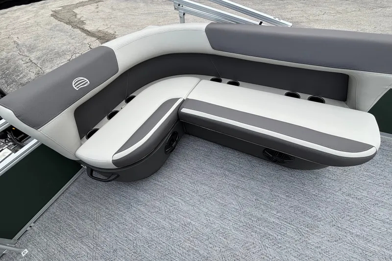 Slide: The Image of 2027 Sun Tracker Bass Buggy 16 XL Select boat seating, featuring gray and white upholstery. - 14