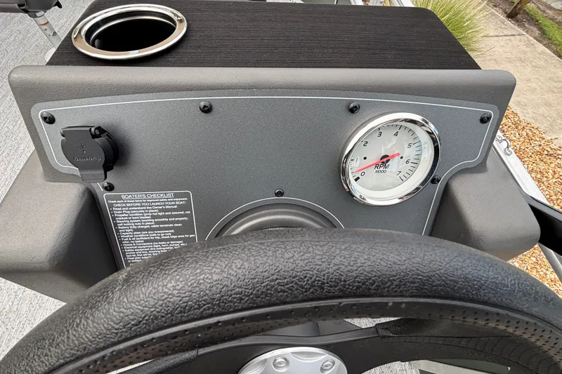 Slide: The Image of Dashboard of 2027 Sun Tracker Bass Buggy 16 XL Select with RPM gauge and cup holder. - 13