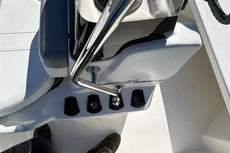Slide: The Image of 2026 Mako Pro Skiff 13 CC boat interior with steering console and seating. - 11