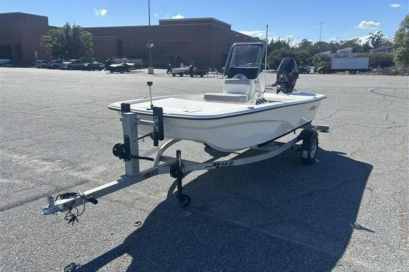 Slide: The Image of 2026 Mako Pro Skiff 13 CC boat on trailer in parking lot. - 3
