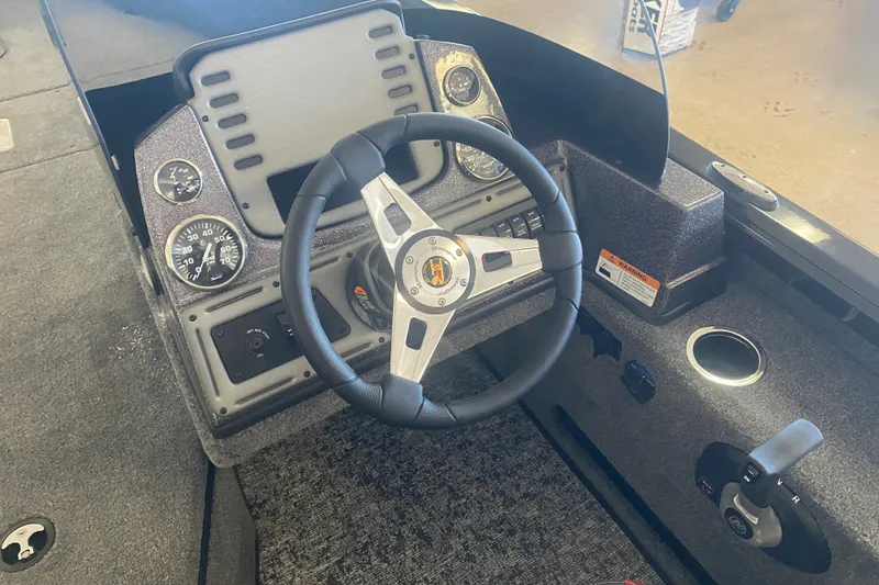 Slide: The Image of 2026 Ranger VS1882SC Reata boat dashboard with steering wheel and instrument panel. - 8