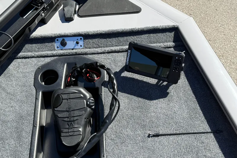 Slide: The Image of 2027 Tracker Pro Team 195 boat deck with Lowrance fish finder and foot pedal. - 15