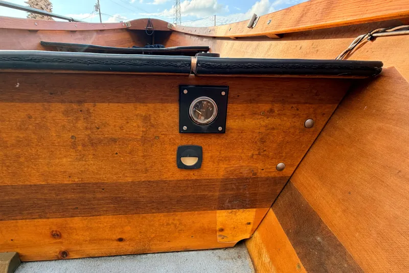 Slide: The Image of Wooden interior of a 2015 Homemade Jetdrive Skiff with gauge and switch. - 10