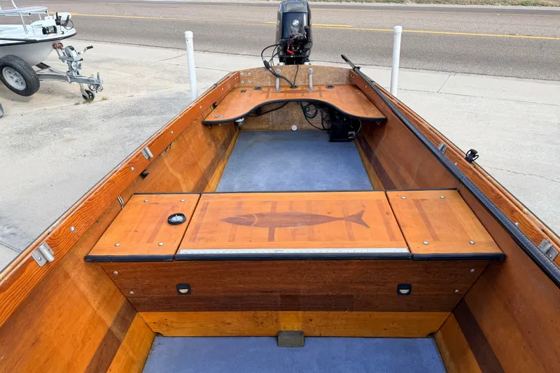 Slide: The Image of Homemade 2015 Jetdrive Skiff with wooden interior and fish design on deck. - 15