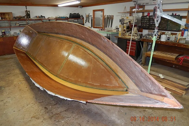 Slide: The Image of Homemade Jetdrive Skiff 2015 under construction in a workshop setting. - 26