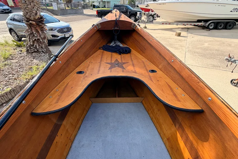 Slide: The Image of Wooden interior of a 2015 Homemade Jetdrive Skiff boat, parked outdoors. - 11