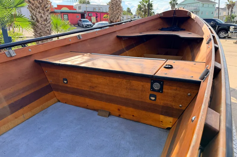 Slide: The Image of Interior of a 2015 Homemade Jetdrive Skiff with wooden finish and storage compartments. - 9