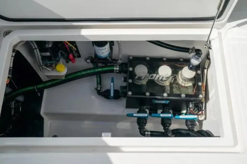 Slide: The Image of 2024 Front Runner 37 Catamaran engine compartment with visible components and wiring. - 105