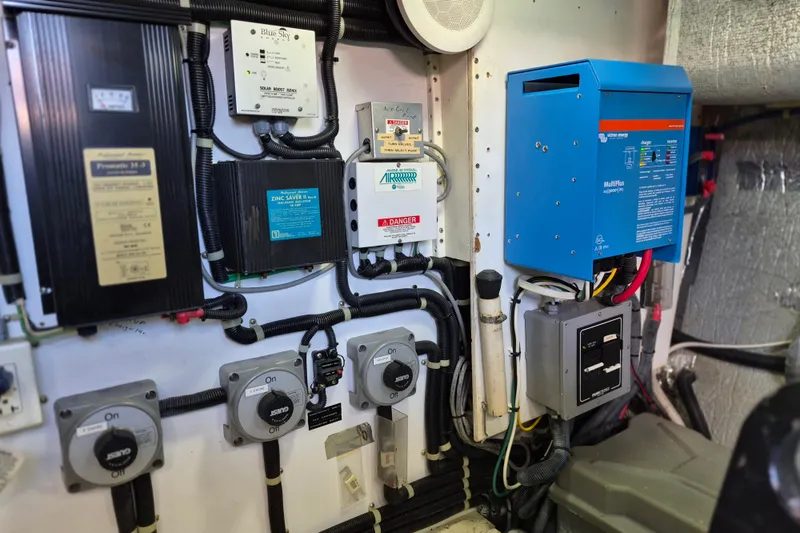 Slide: The Image of Electrical panel in 2003 Navigator Californian Veneti boat, featuring various control systems and wiring. - 55