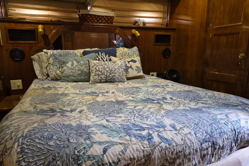 Slide: The Image of Cozy bedroom in 2003 Navigator Californian Veneti yacht with nautical-themed bedding. - 49