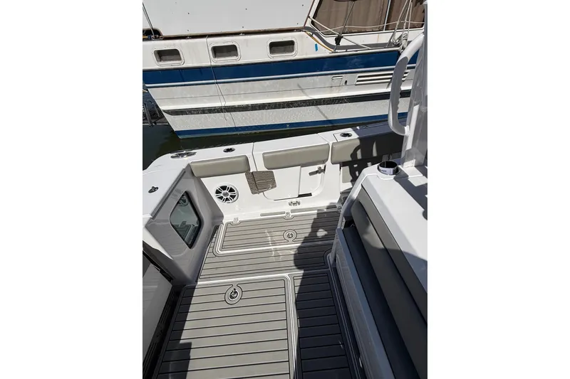 Slide: The Image of 2024 Sportsman Open 302 Center Console boat interior with sleek seating and modern design. - 16
