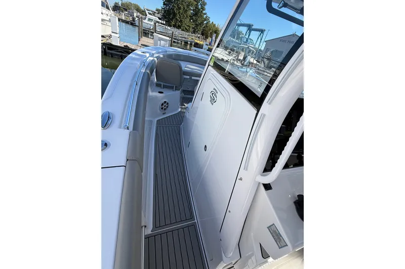 Slide: The Image of 2024 Sportsman Open 302 Center Console boat with sleek deck design and modern features. - 19