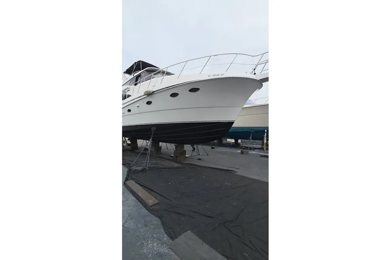 Slide: The Image of 1993 McKinna 48 Pilothouse yacht on dry dock, side view. - 120