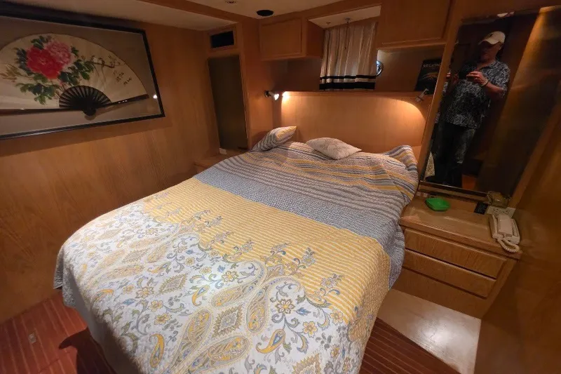 Slide: The Image of Cozy bedroom in 1993 McKinna 48 Pilothouse yacht with decorative fan art. - 59